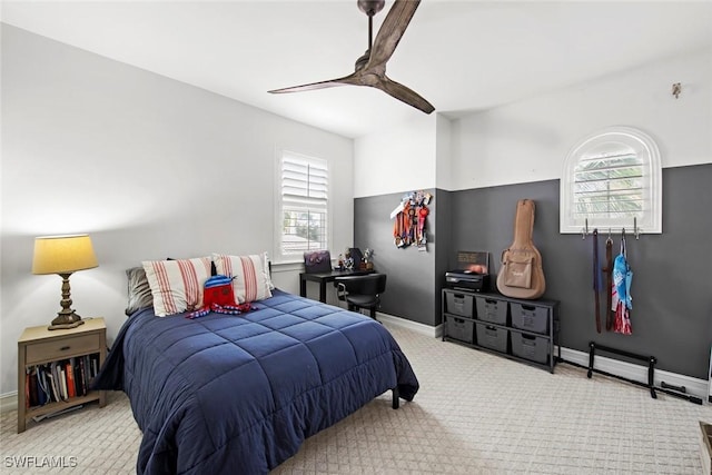 bedroom featuring ceiling fan, carpet, and baseboards