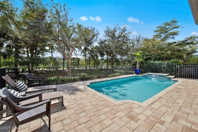 view of swimming pool with fence, a fenced in pool, and a patio