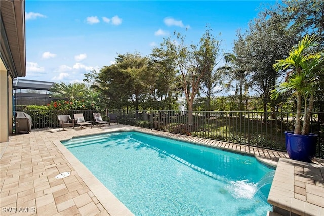 view of pool featuring fence, a fenced in pool, and a patio