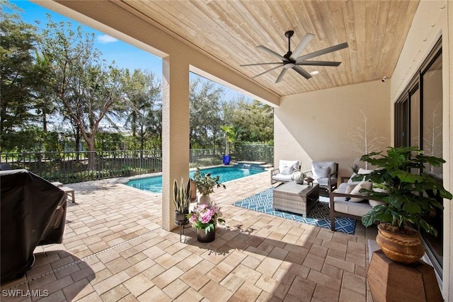 view of patio / terrace featuring a fenced backyard, an outdoor living space, a fenced in pool, and ceiling fan