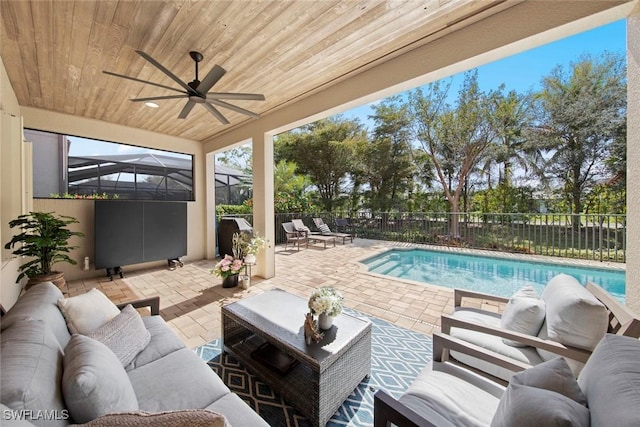 view of patio featuring a fenced in pool, ceiling fan, a fenced backyard, a lanai, and an outdoor living space