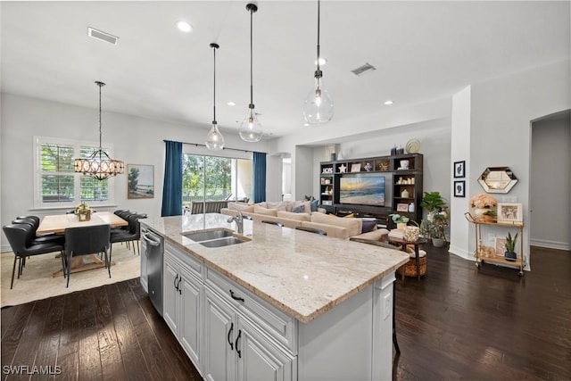 kitchen featuring visible vents, a sink, and dark wood-style floors