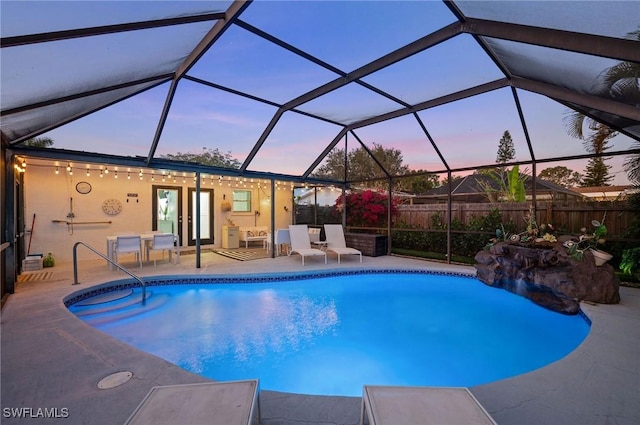 view of pool with a fenced in pool, a patio area, glass enclosure, and fence