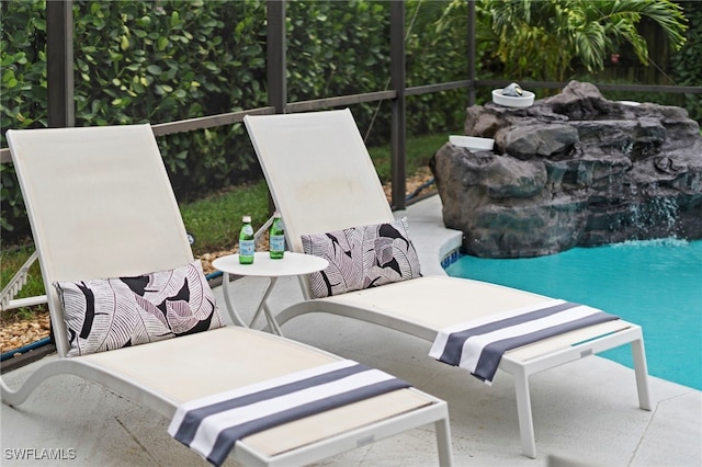 view of patio with an outdoor pool