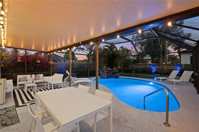 view of pool with a fenced in pool, an outdoor hangout area, glass enclosure, a patio area, and a fenced backyard