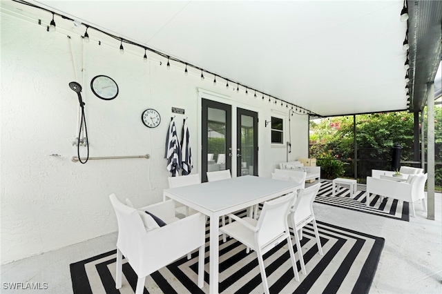 view of patio featuring french doors and outdoor dining area