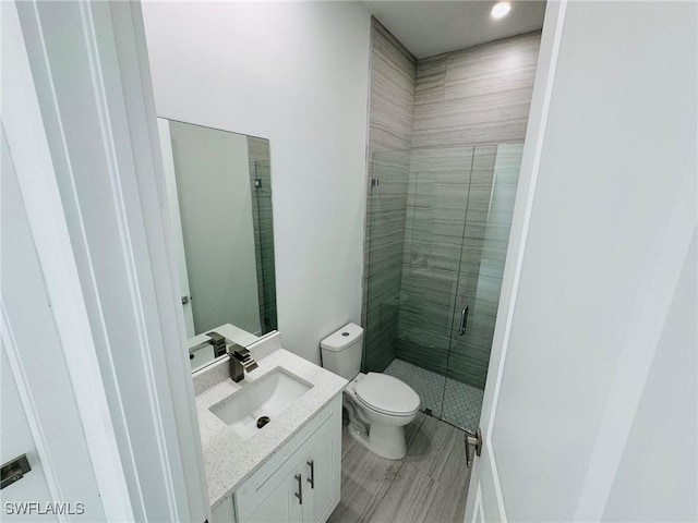 3539 NE 14th Pl, Cape Coral, FL 33909 - bathroom featuring a shower stall, toilet, and vanity