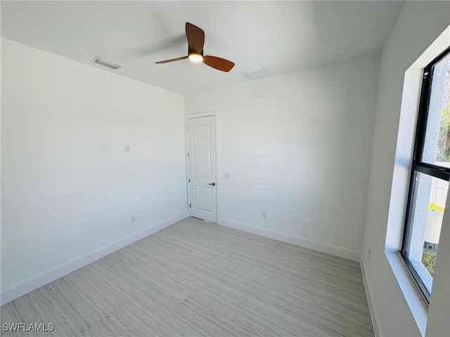 spare room featuring ceiling fan