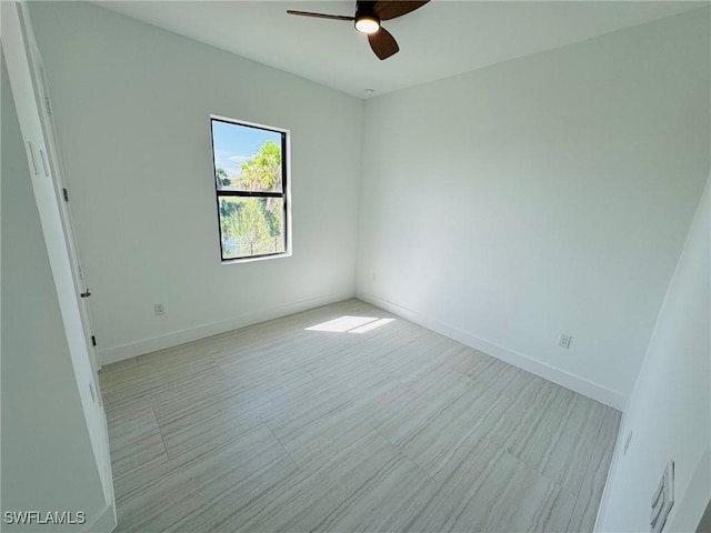 spare room with ceiling fan