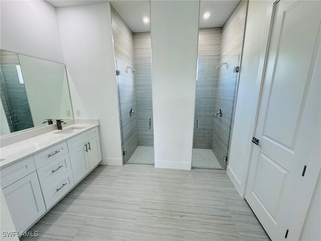 bathroom with vanity and walk in shower