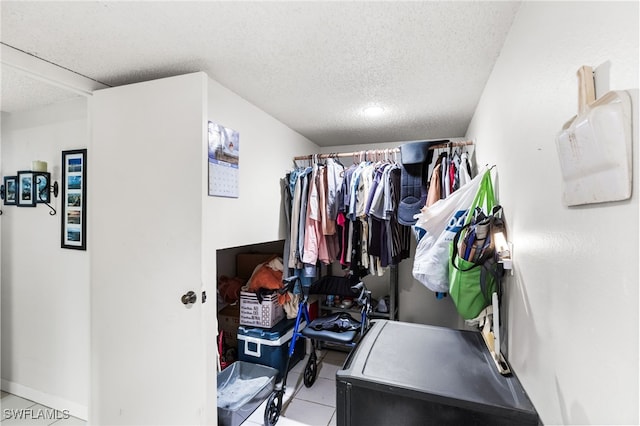 spacious closet with light tile patterned flooring