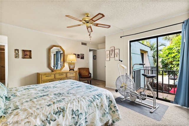 bedroom with access to exterior, carpet, visible vents, a ceiling fan, and a textured ceiling