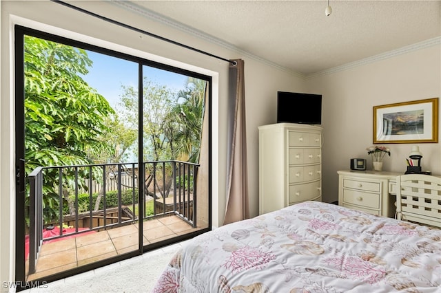 bedroom featuring access to exterior, crown molding, and a textured ceiling