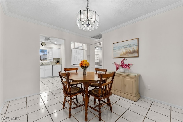 1050 Lake Mcgregor Dr Unit 6747, Fort Myers, FL 33919 - dining space with crown molding, a textured ceiling, baseboards, and light tile patterned floors