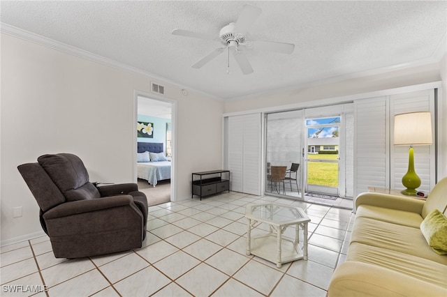 1050 Lake Mcgregor Dr Unit 6747, Fort Myers, FL 33919 - living area with a textured ceiling, ornamental molding, light tile patterned flooring, and visible vents