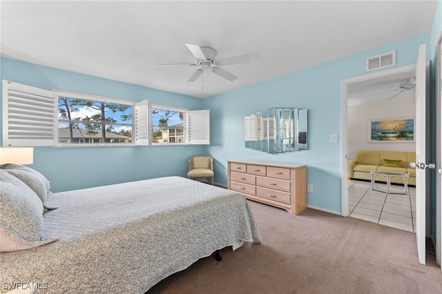 1050 Lake Mcgregor Dr Unit 6747, Fort Myers, FL 33919 - carpeted bedroom featuring a ceiling fan, visible vents, baseboards, and tile patterned floors
