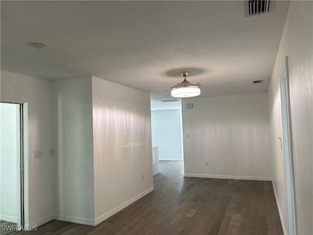 hall with dark hardwood / wood-style floors