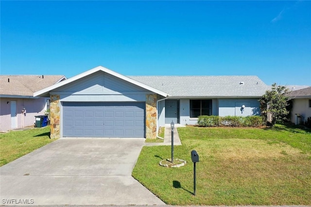 ranch-style home featuring an attached garage, driveway, and a front yard