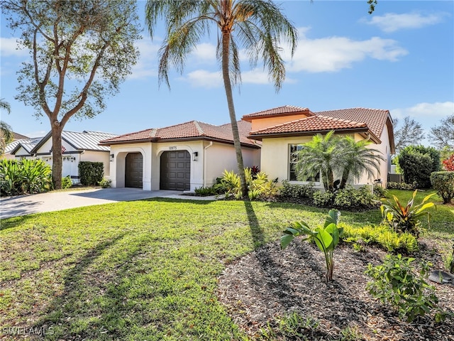 mediterranean / spanish-style home with concrete driveway, a tiled roof, an attached garage, a front lawn, and stucco siding