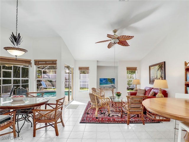 living area with lofted ceiling and a ceiling fan