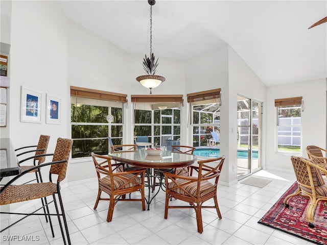 sunroom featuring vaulted ceiling