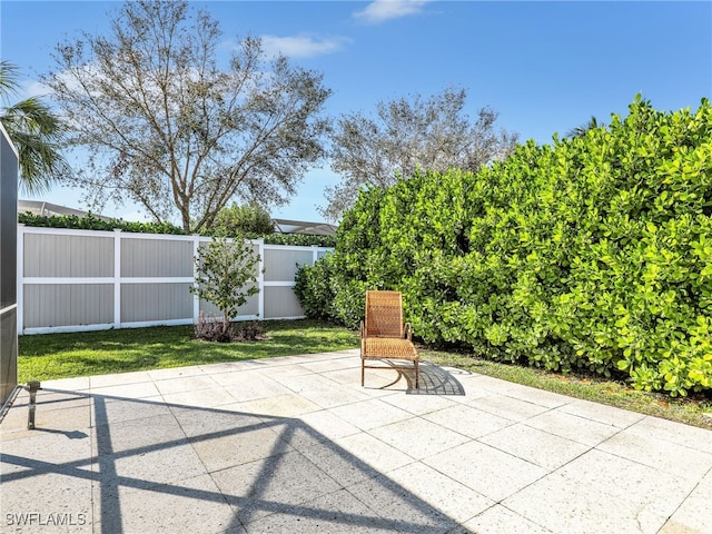 view of patio featuring fence