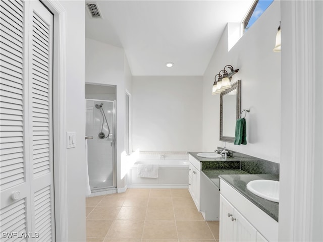 full bathroom with a closet, visible vents, a stall shower, a sink, and tile patterned floors