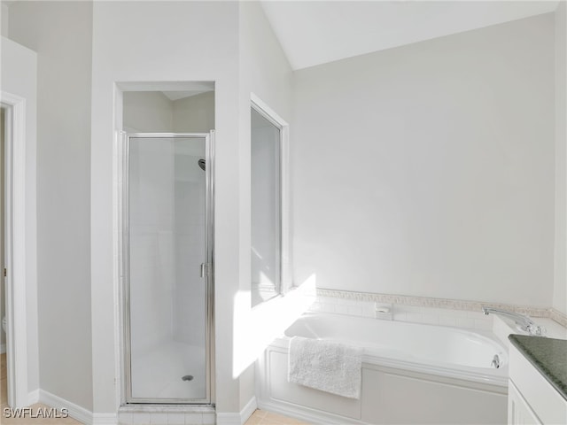 bathroom featuring a stall shower and vanity