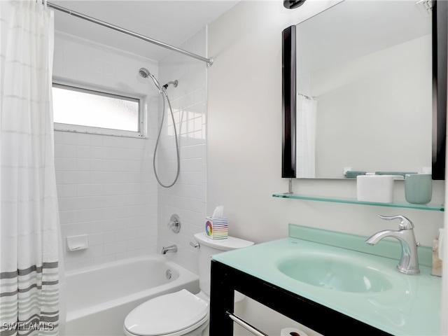 bathroom with toilet, shower / bath combo, and vanity