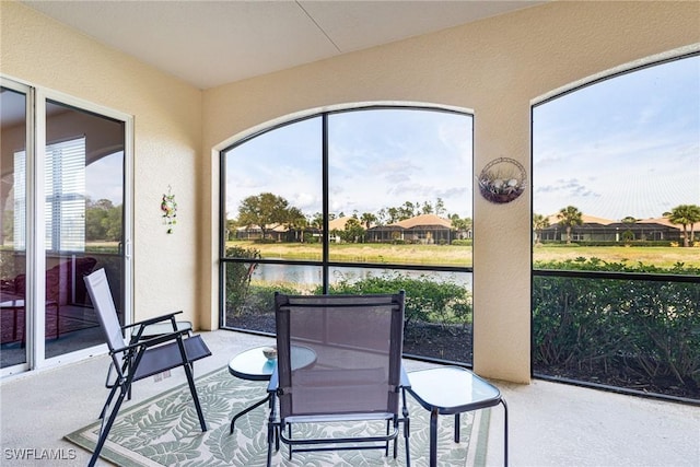 10644 Pelican Preserve Blvd Unit 102, Fort Myers, FL 33913 - sunroom with a textured wall and a water view
