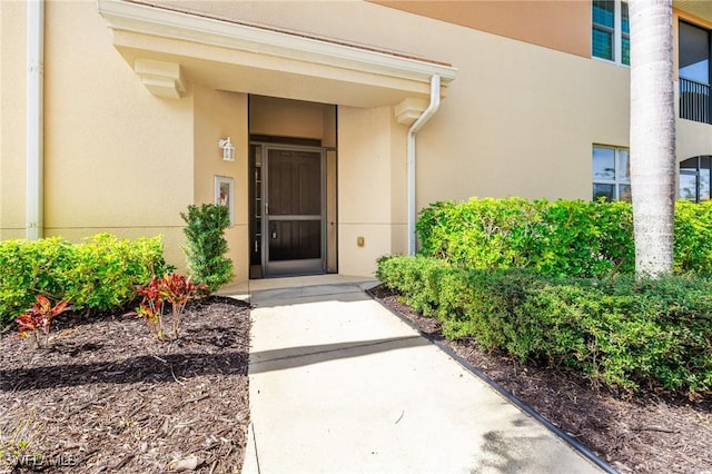 10644 Pelican Preserve Blvd Unit 102, Fort Myers, FL 33913 - view of exterior entry featuring stucco siding