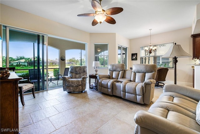 10644 Pelican Preserve Blvd Unit 102, Fort Myers, FL 33913 - living area featuring a chandelier and ceiling fan