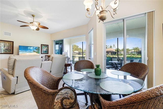 10644 Pelican Preserve Blvd Unit 102, Fort Myers, FL 33913 - dining area featuring a chandelier, ceiling fan, and light tile patterned floors