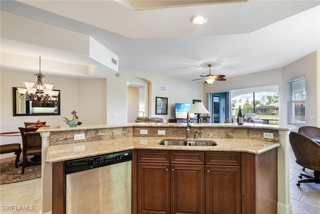 10644 Pelican Preserve Blvd Unit 102, Fort Myers, FL 33913 - kitchen with stainless steel dishwasher, open floor plan, a sink, and light stone countertops