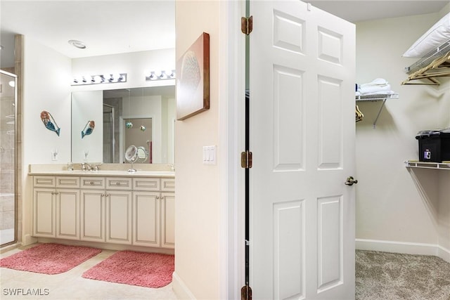 10644 Pelican Preserve Blvd Unit 102, Fort Myers, FL 33913 - full bathroom featuring tiled shower, double vanity, and baseboards