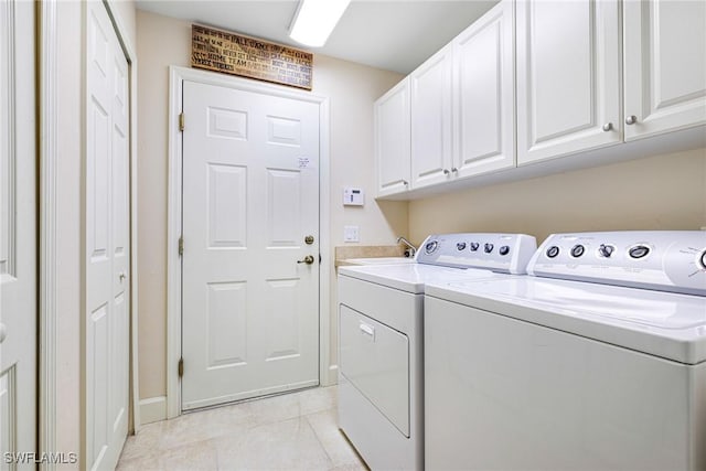 10644 Pelican Preserve Blvd Unit 102, Fort Myers, FL 33913 - laundry area featuring washing machine and clothes dryer, cabinet space, light tile patterned floors, and baseboards