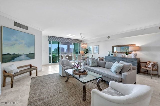 living area featuring a chandelier, a view of city, visible vents, and crown molding