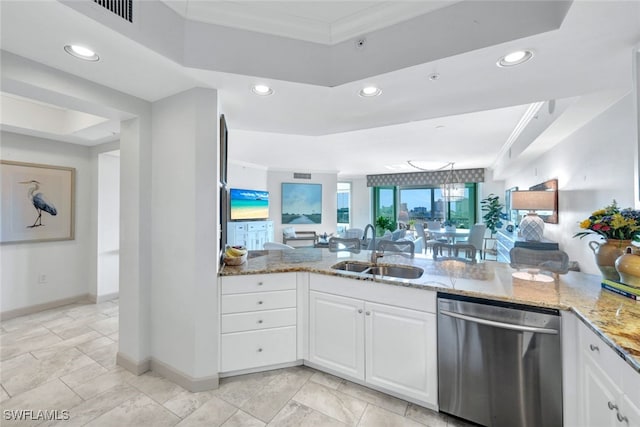 kitchen featuring a sink, white cabinetry, open floor plan, light stone countertops, and dishwasher