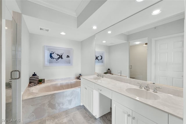 full bathroom with a garden tub, double vanity, a sink, and a shower stall