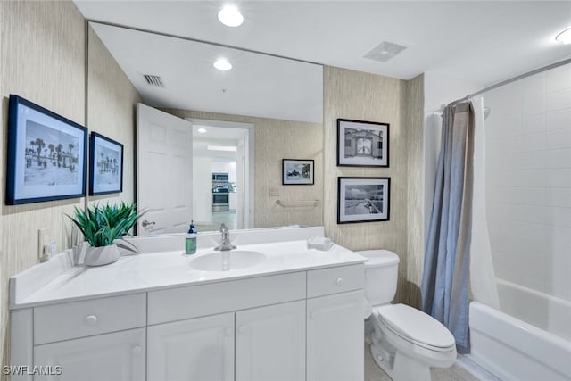 bathroom with toilet, visible vents, shower / bath combo with shower curtain, and vanity