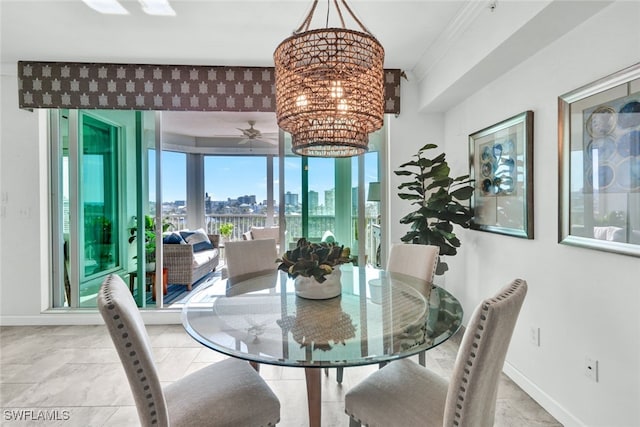 dining space featuring a view of city, baseboards, and an inviting chandelier