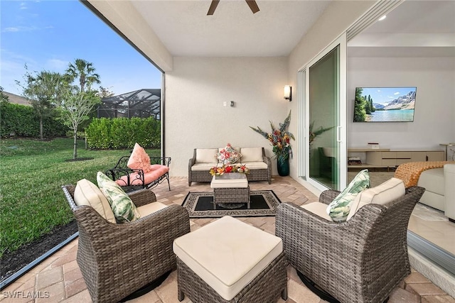 view of patio featuring a ceiling fan and an outdoor living space