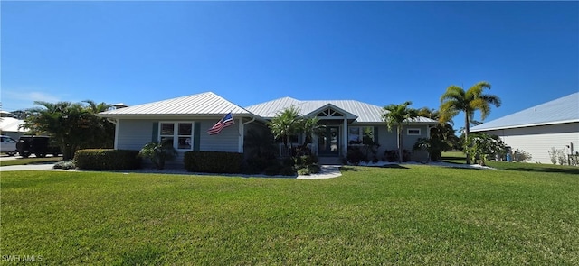 single story home featuring a front lawn