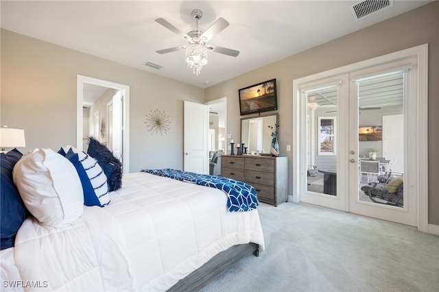 bedroom featuring light colored carpet, access to outside, visible vents, and a ceiling fan