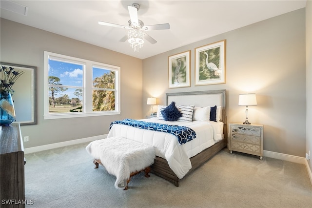 bedroom with baseboards, ceiling fan, and light colored carpet