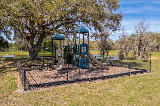 communal playground featuring a water view and a yard