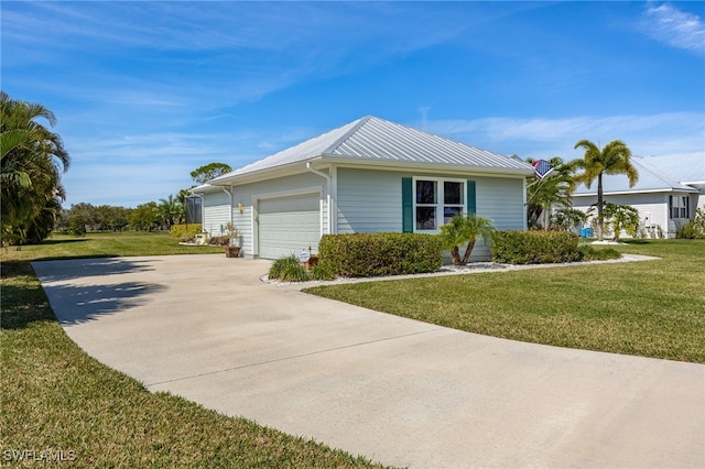 view of property exterior with a garage, metal roof, a yard, and concrete driveway