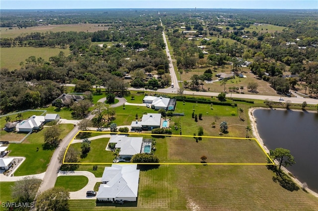 bird's eye view featuring a residential view and a water view