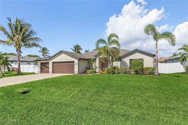 ranch-style house featuring a garage and a front yard