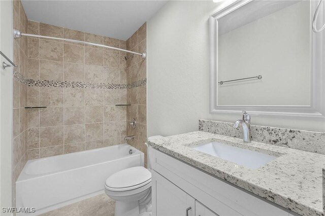 1729 SW 22nd Ter, Cape Coral, FL 33991 - full bathroom with toilet, vanity, and tiled shower / bath combo